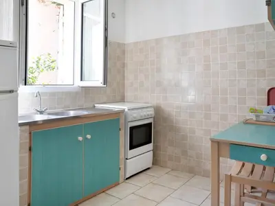 a kitchen with a sink and a stove at Holiday Home Les Chênes by Interhome in Borgo