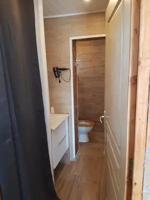a small bathroom with a toilet and a sink at L Appicciu in Ventiseri