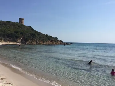 a group of people in the water at the beach at Villa di Pardisoli in Prunelli-di-Fiumorbo