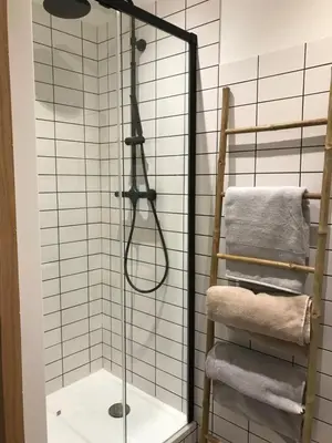 a shower in a bathroom with a glass shower backdoor at Studio plein centre ville in Ajaccio