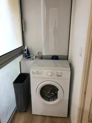 a washer and dryer in a small room at Studio plein centre ville in Ajaccio