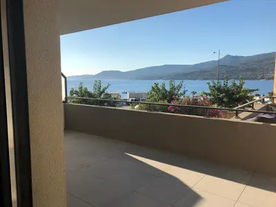 a balcony with a view of the water at Fronte di Mare in Propriano