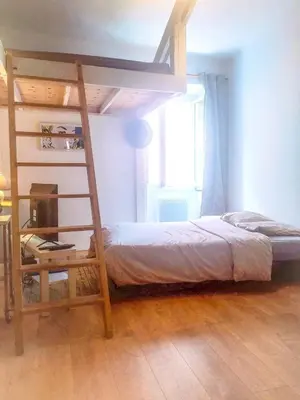 a bedroom with a bunk bed with a ladder at Le Studio du Cardinal Central/ Wifi/ Ajaccio à pieds! in Ajaccio