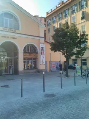 a building with a tree in the middle of a street at Le Studio du Cardinal Central/ Wifi/ Ajaccio à pieds! in Ajaccio