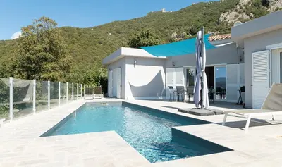 a villa with a swimming pool and a house at Au Cœur de l'arrière pays DOMAINE A PRESA Villas avec Piscine Privée & chauffée in Matra