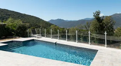 a swimming pool with mountains in the background at Au Cœur de l'arrière pays DOMAINE A PRESA Villas avec Piscine Privée & chauffée in Matra