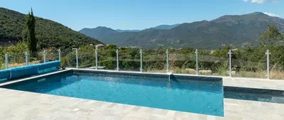 a swimming pool with a view of a mountain at Au Cœur de l'arrière pays DOMAINE A PRESA Villas avec Piscine Privée & chauffée in Matra