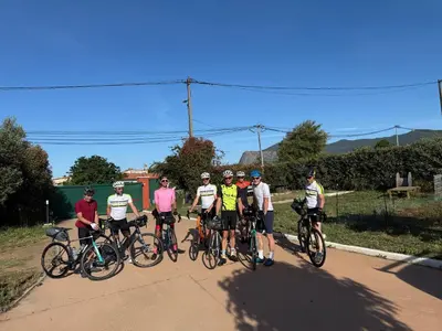a group of people riding bikes on a road at Chalet zen in Peri
