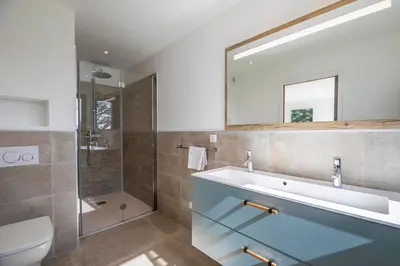 a bathroom with a sink and a mirror at Villa 19 in Zonza