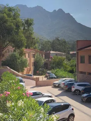a bunch of cars parked in a parking lot at Résidence Porto Marine in Porto Ota