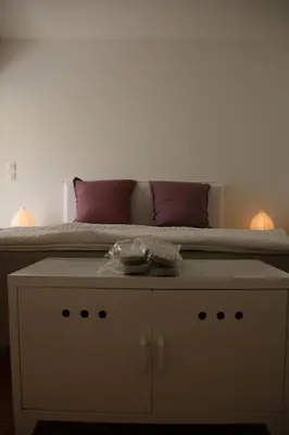 a bed sitting on top of a dresser under a bed at VILLA GOLFE AJACCIO près des plages in Ajaccio