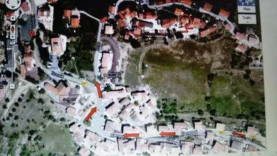a map of a city with red arrows at Maison de village in Moltifao