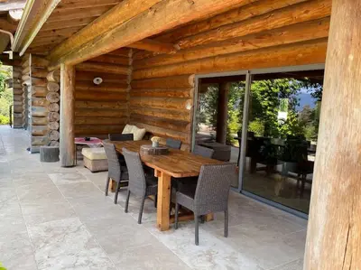 a kitchen with wooden walls and a stove at Casa Laricciu in Figari