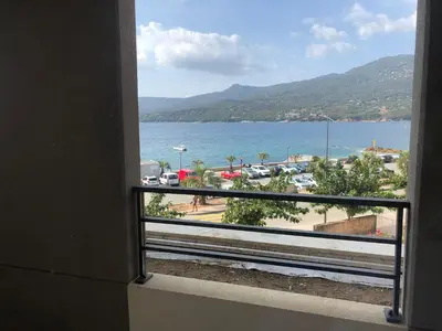a view of the ocean from a balcony at T3 vue mer in Propriano