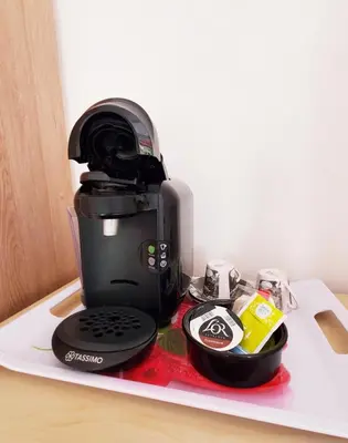 a coffee maker sitting on top of a counter at Chambre d'hôte Kalango proche de la plage-Piscine in Lucciana