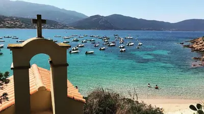 a group of boats in the water at a beach at Les Maisonnettes de Lava - Golfe de Lava - APPIETTO in Appietto