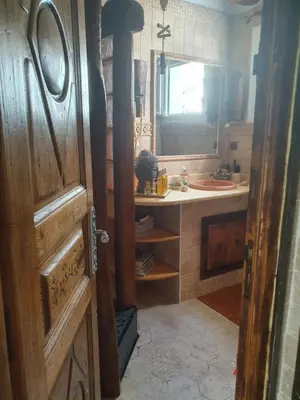 an open door to a kitchen with a sink at maison de charme avec piscine et vue exceptionnelle in Scolca