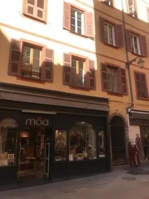 a store front of a building with a mox storefront at Grand studio rue piétonne Ajaccio in Ajaccio