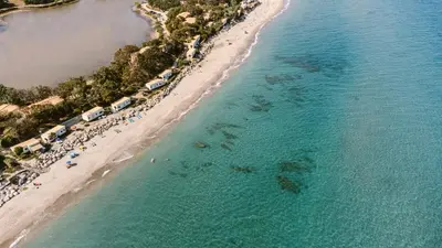 an aerial view of a beach with a group of people at Domaine Naturiste de Riva Bella in Linguizzetta