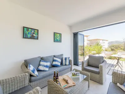 a living room with a couch and chairs at Apartment Bastion-17 by Interhome in Porto-Vecchio