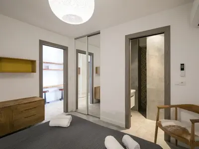a kitchen with a dining room table and chairs at Apartment Château-18 by Interhome in Porto-Vecchio