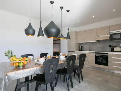 a bedroom with a bed and a desk and a television at Apartment Château-18 by Interhome in Porto-Vecchio