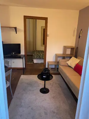 a living room with a couch and a table at Auberge du cheval blanc in Ajaccio