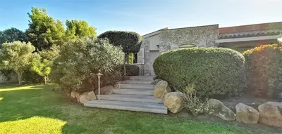 a set of stairs leading up to a house at Villa Le Lagon - Vision Luxe in Bonifacio