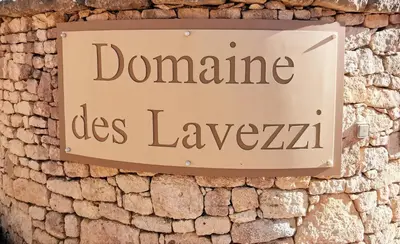 a sign on a brick wall that reads domaine les lelezlez at Villa Le Lagon - Vision Luxe in Bonifacio
