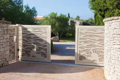 a pair of gates with horses on them at Villa Le Lagon - Vision Luxe in Bonifacio