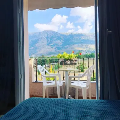 a table and chairs on a balcony with a view at L'Acqua Viva in Calacuccia
