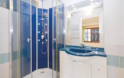a bathroom with a sink and a shower at Pet Friendly Apartment in Pianottoli-Caldarello