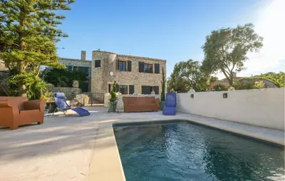 a swimming pool in the backyard of a house at Pet Friendly Apartment in Pianottoli-Caldarello