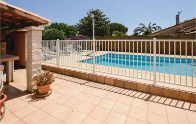 a swimming pool with a white fence around it at Awesome Home In Borgo in Borgo