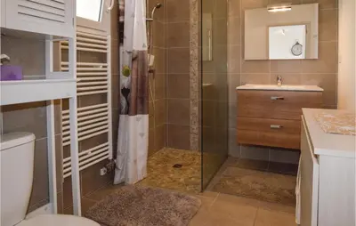 a bathroom with a shower and a toilet and a sink at Gorgeous Apartment In Ajaccio With Wifi in Ajaccio