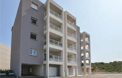 an apartment building with balconies on the side of it at Gorgeous Apartment In Ajaccio With Wifi in Ajaccio