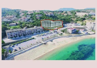 an aerial view of a resort and the beach at Appartement neuf tout confort en bord de mer in Propriano