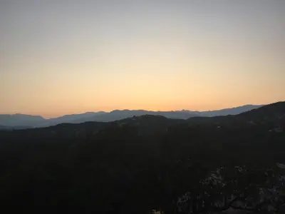 a view of the sunset from the top of a mountain at Villa Mamago in Cirendinu