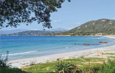 a view of a beach with mountains in the background at Amazing Home In Coti-Chiavari in Coti-Chiavari