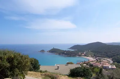 a view of a large body of water with a town at CAROLE F2 in Sainte-Lucie de Porto-Vecchio