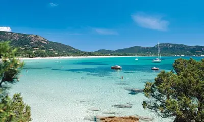 a view of a beach with boats in the water at Suarella in Propriano