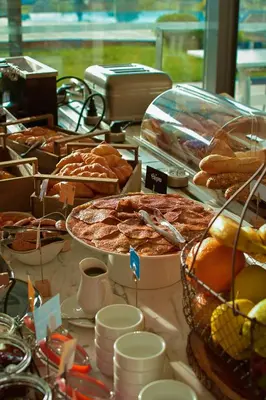 a table filled with lots of different types of food at Golden Tulip Porto-Vecchio in Porto-Vecchio