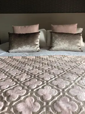 a bed with two pillows on top of it at Hôtel & Résidence Les Bergeries d'Alata in Alata
