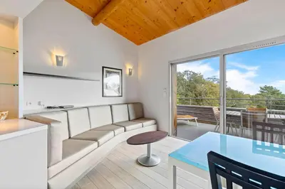 a living room with a couch and a table at Résidence Cala Sultana Appartement T2 in Porto-Vecchio