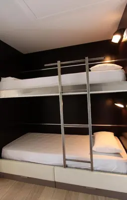 a room with three bunk beds in a room at Résidence Cala Sultana Appartement T2 in Porto-Vecchio