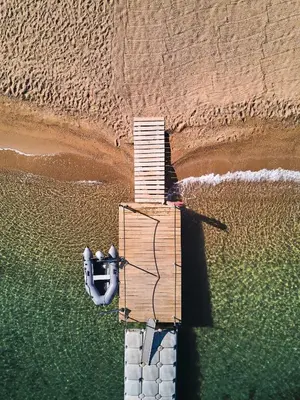 an aerial view of a boat in the water at Hotel Restaurant Mariosa in Porto-Vecchio