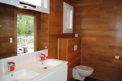 a bathroom with a white sink and a toilet at VILLA ANGELINI in Valle-di-Campoloro