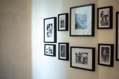 a group of framed pictures on a wall at Villa Milanu in Oletta