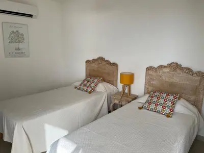 a bedroom with a bed with a view of the ocean at Résidence Castugna in Cargèse