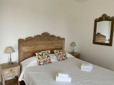 a bedroom with a bed with towels on it at Résidence Castugna in Cargèse
